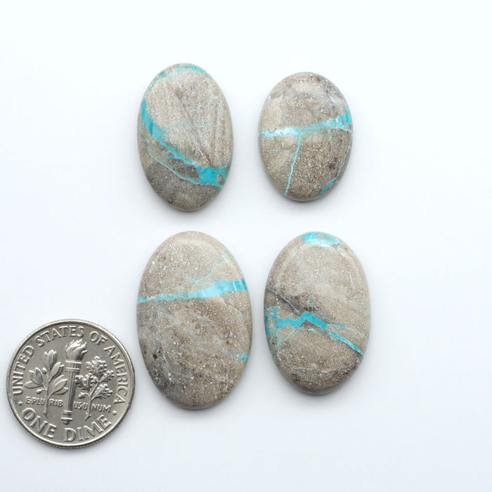 Carico Lake Turquoise cabochons with vibrant aqua-blue to turquoise tones and natural matrix, ideal for rings, pendants, and artisan jewelry.