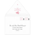 White envelope with a coral motif and block return address on the flap. Scrip and block address on the front.