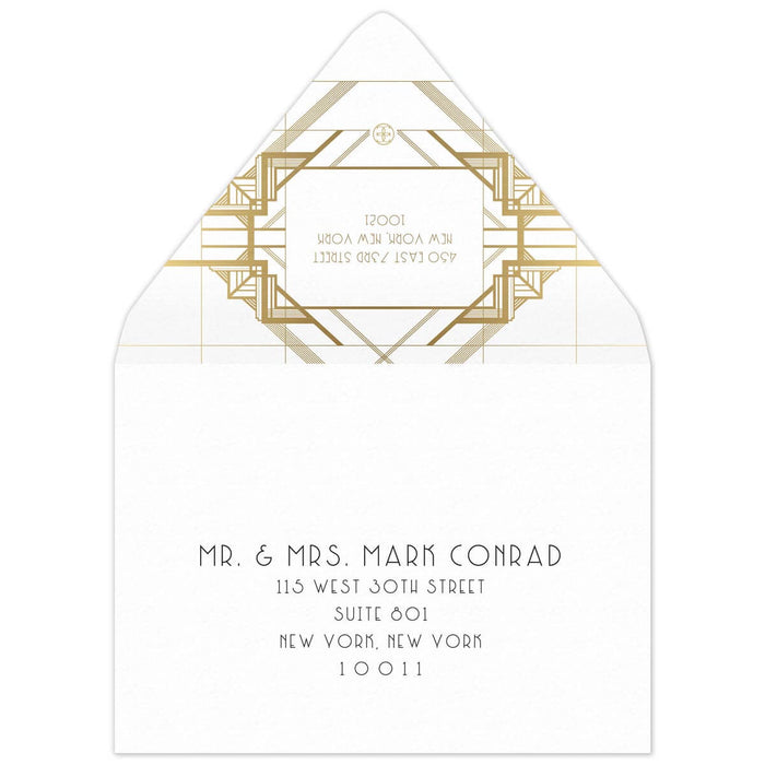 White envelope with gold geometric lines on the back flap. White box in between the lines of a deco font of the reply address. Black deco mailing address centered on the front of the envelope.