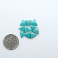 Hubei Cloud Mountain Turquoise cabochons, blue and green color with black matrix, polished stones on a white background with a US dime for scale