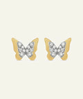 Butterfly-shaped earrings with gold and silver design on a white background