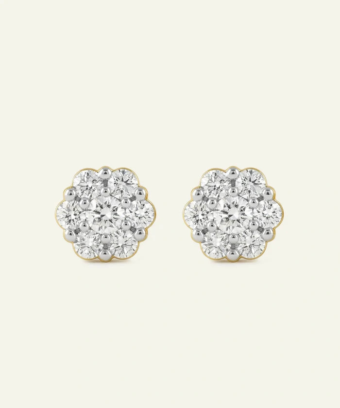Pair of diamond stud earrings on a light gray background
