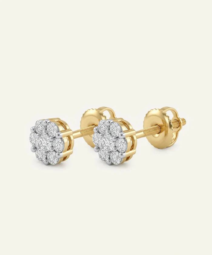 Gold earrings with diamond accents on a white background
