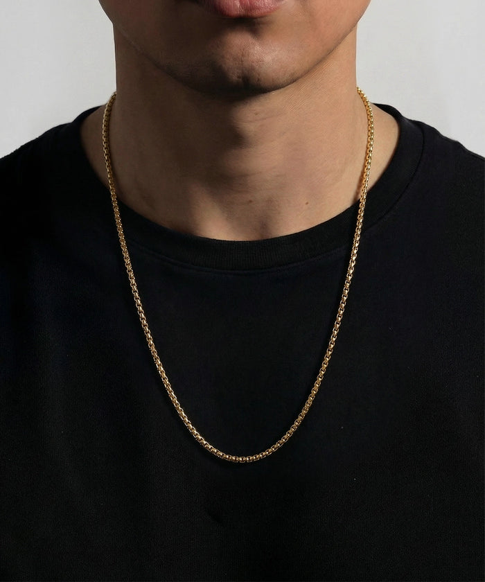 Link N Lock® men's gold-toned stainless steel box chain necklace on model wearing black shirt