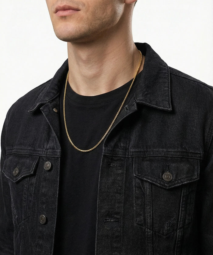 Link N Lock® men's gold-toned stainless steel box chain necklace on model wearing black denim jacket