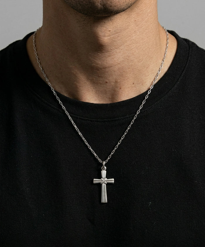 Close-up of Link N Lock® silver cross pendant