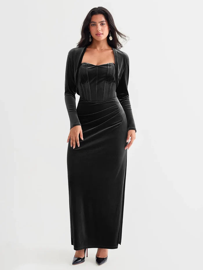Black velvet long-sleeve shrug bolero layered over a matching corset dress.