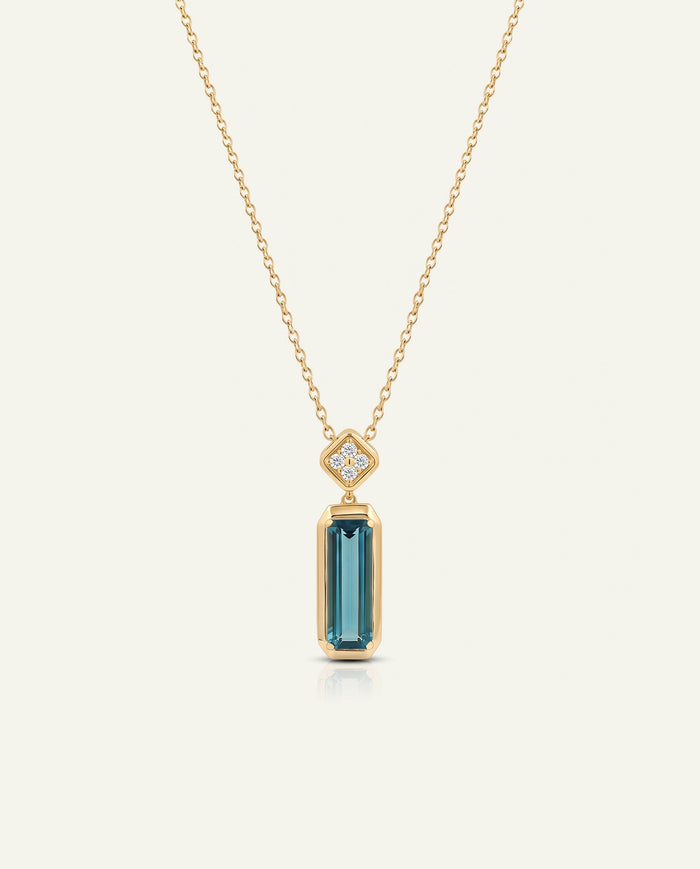 A rose gold pendant necklace featuring a geometric Art Deco style drop pendant with a central rectangular purple gemstone and small clear accent stones, shown on a white background with a subtle reflection.