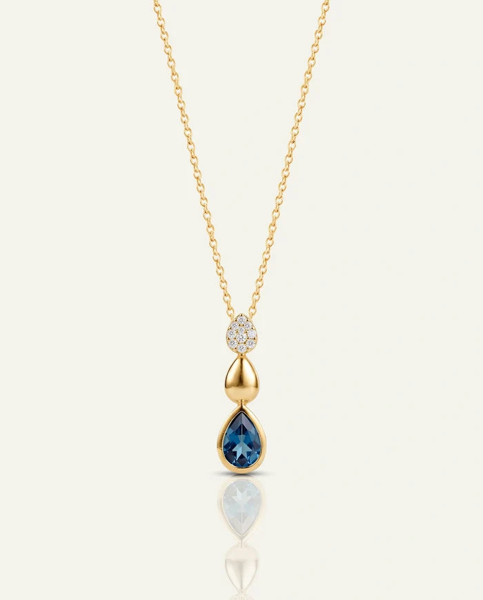 Gold necklace with a diamond pendant on a white background