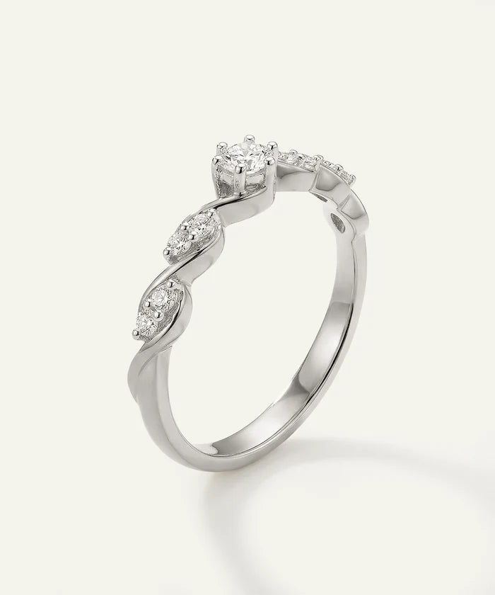 Silver ring with diamond accents on a white background
