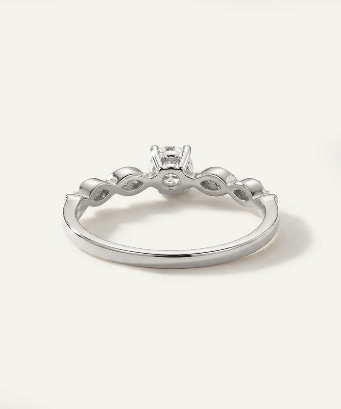 Silver ring with a diamond on a white background