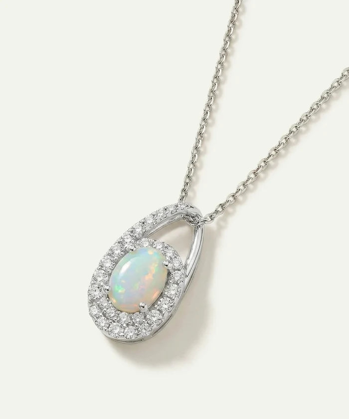Opal pendant necklace with chain on a white background