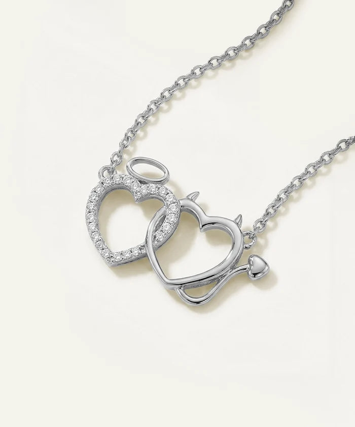 Silver heart-shaped necklace on a white background