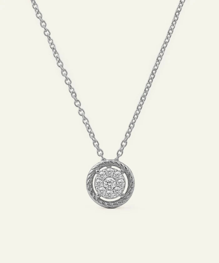Silver necklace with a round pendant on a white background