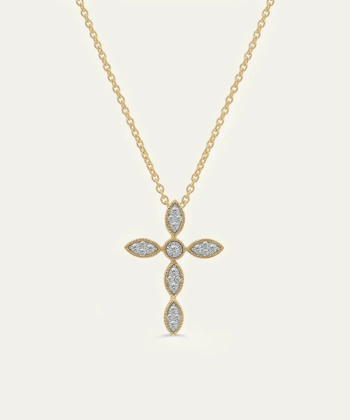 Gold necklace with a cross pendant on a light gray background