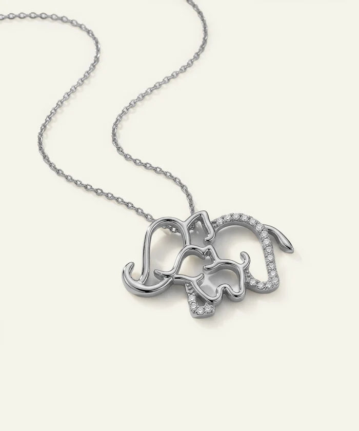 Silver elephant pendant necklace on a white background
