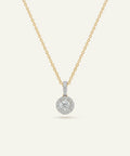Gold necklace with a diamond pendant on a white background