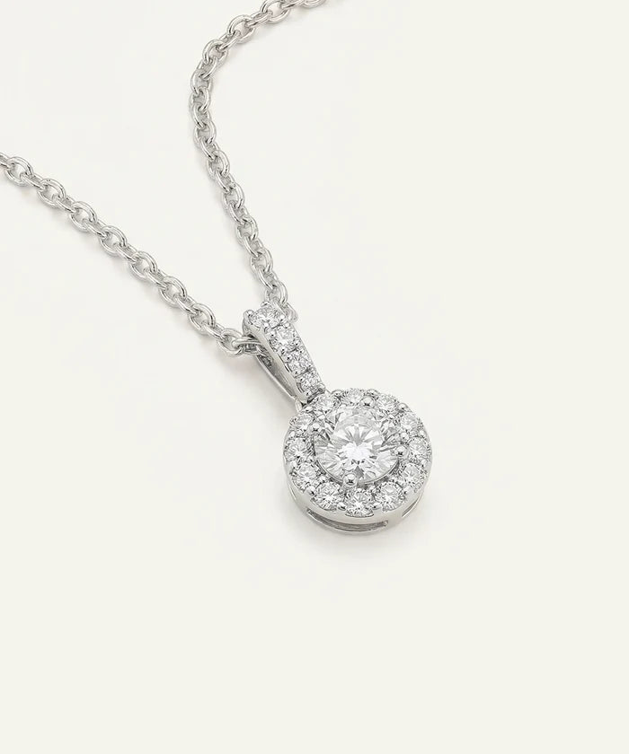Diamond pendant necklace on a white background
