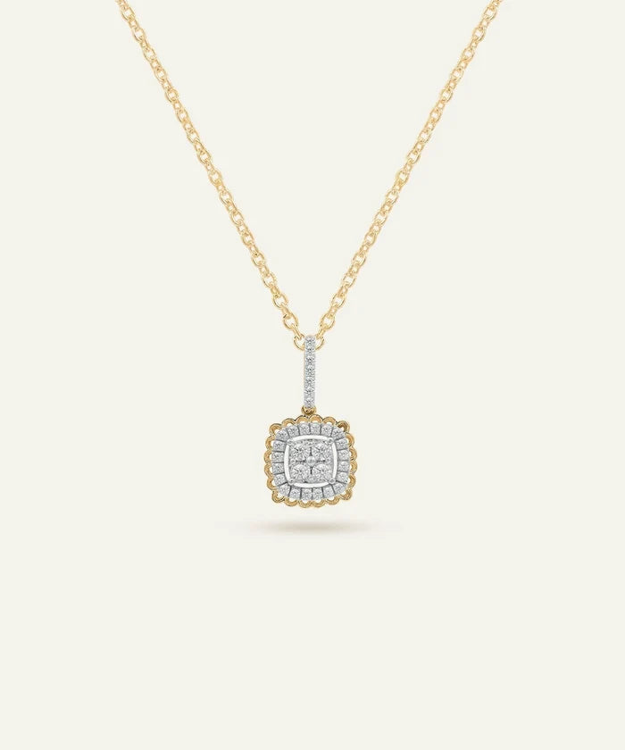 Gold necklace with a square pendant on a light beige background