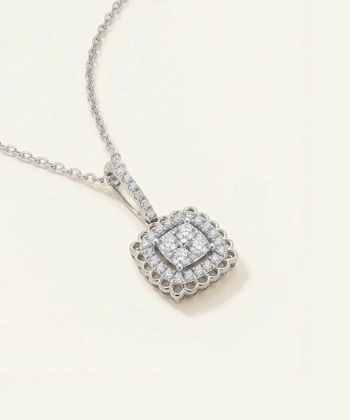 Diamond necklace with a square pendant on a light background