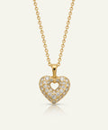 Gold heart-shaped necklace with diamond accents on a white background