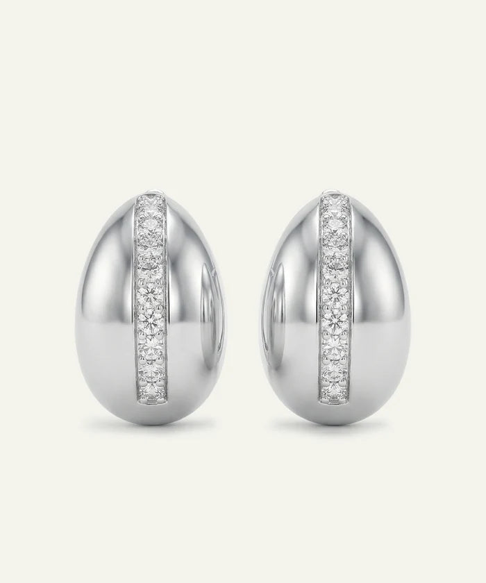 Pair of silver earrings with diamond accents on a white background