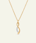 Gold necklace with a diamond pendant on a white background