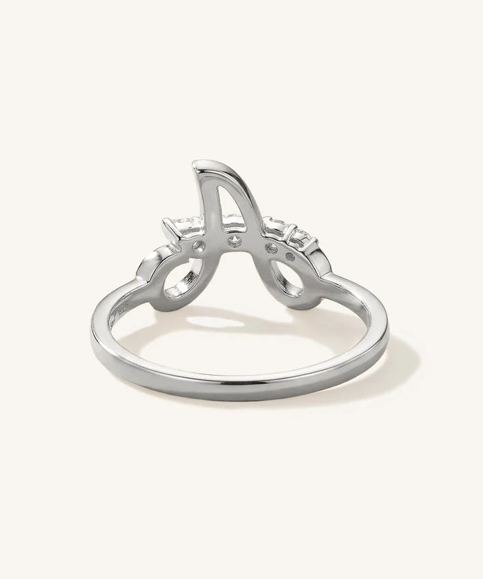 Silver ring with letter 'A' design on a white background