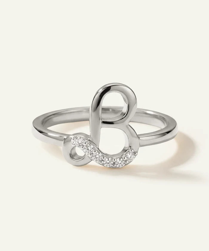 Silver ring with a unique design on a white background