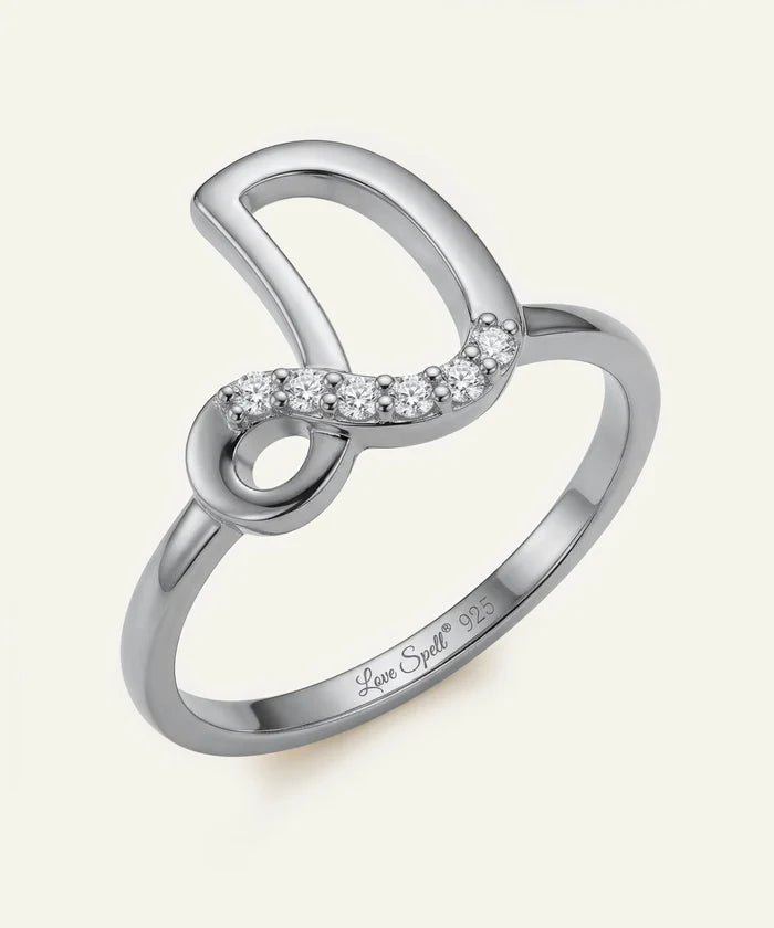 Silver ring with diamond accents on a white background