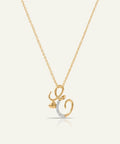 Gold necklace with a unique pendant on a light beige background
