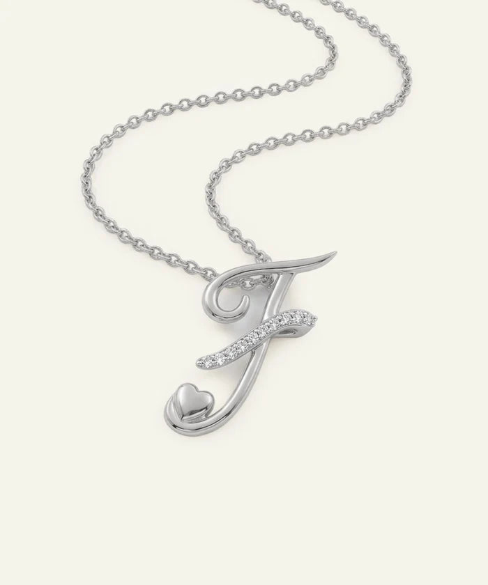 Silver necklace with a letter 'J' pendant on a white background