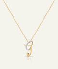 Gold necklace with a unique pendant on a white background