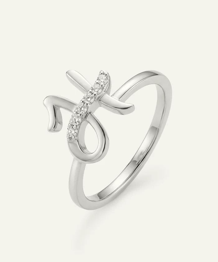 Silver ring with a decorative design on a white background