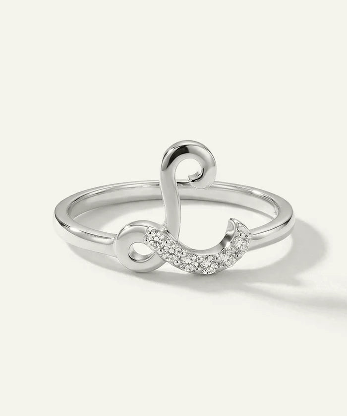 Silver ring with a unique design on a white background
