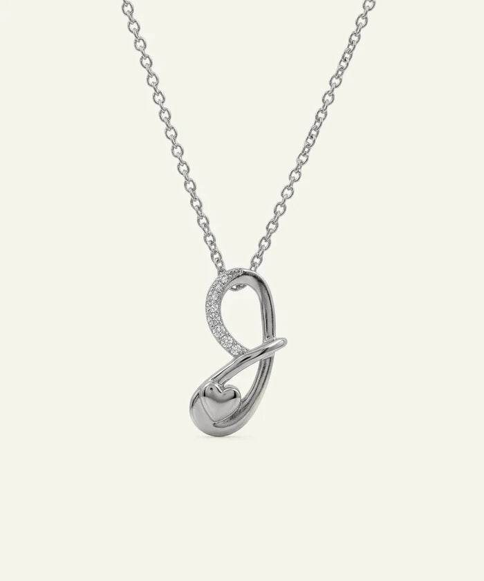 Silver necklace with an infinity symbol pendant on a white background