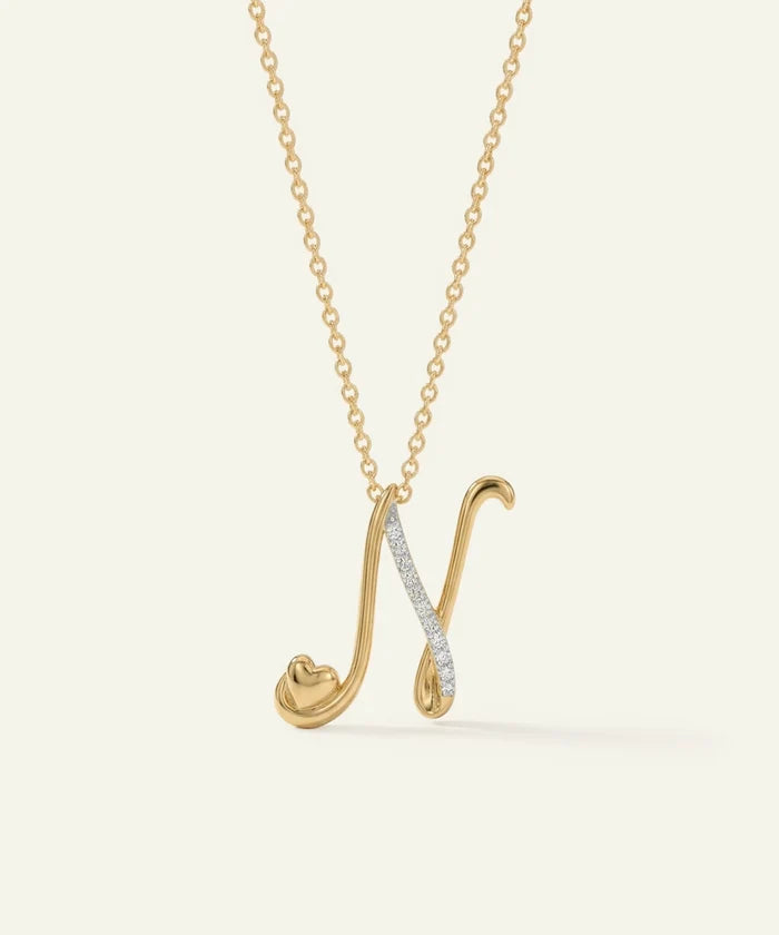 Gold necklace with a unique pendant on a light beige background