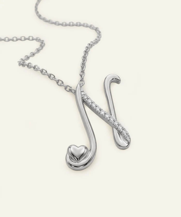 Silver necklace with a unique pendant on a white background