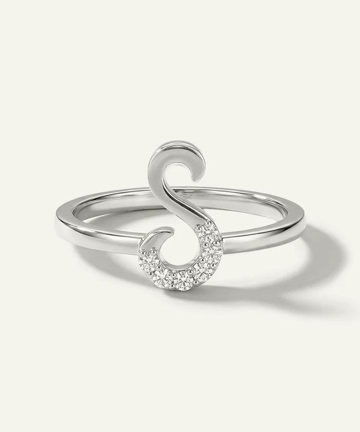 Silver ring with a unique design on a white background