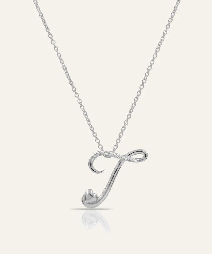 Silver necklace with a letter 'J' pendant on a white background