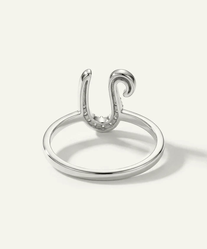 Silver ring with a unique design on a white background