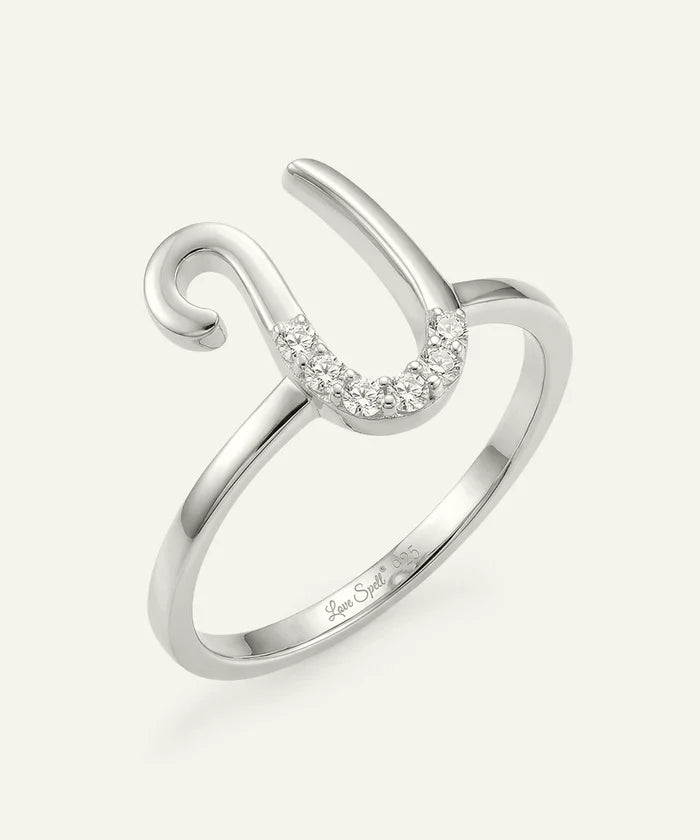 Silver ring with a curved design and small diamonds on a white background