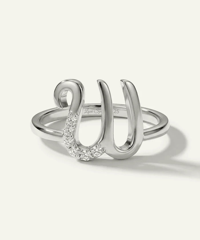 Silver ring with a unique design on a white background