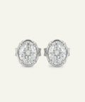 Pair of diamond stud earrings on a light gray background
