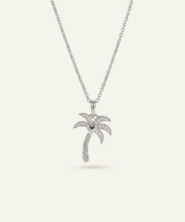 Silver palm tree pendant necklace on a white background
