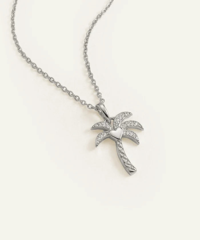 Silver palm tree necklace on a white background
