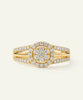 Gold ring with diamond accents on a light beige background