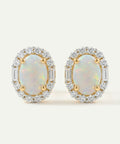 Pair of opal earrings with gold and diamond accents on a light background