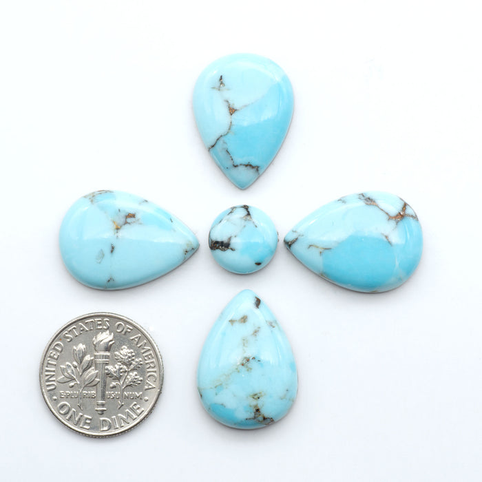 Enhance your jewelry designs with Pressed Turquoise Nugget Cabochons. Crafted from composite materials they add a captivating touch to your creations.