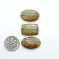 Royston Turquoise cabochons are famous for their distinctive matrix and unique green and blue hues, making them a favored option among jewelry designers.